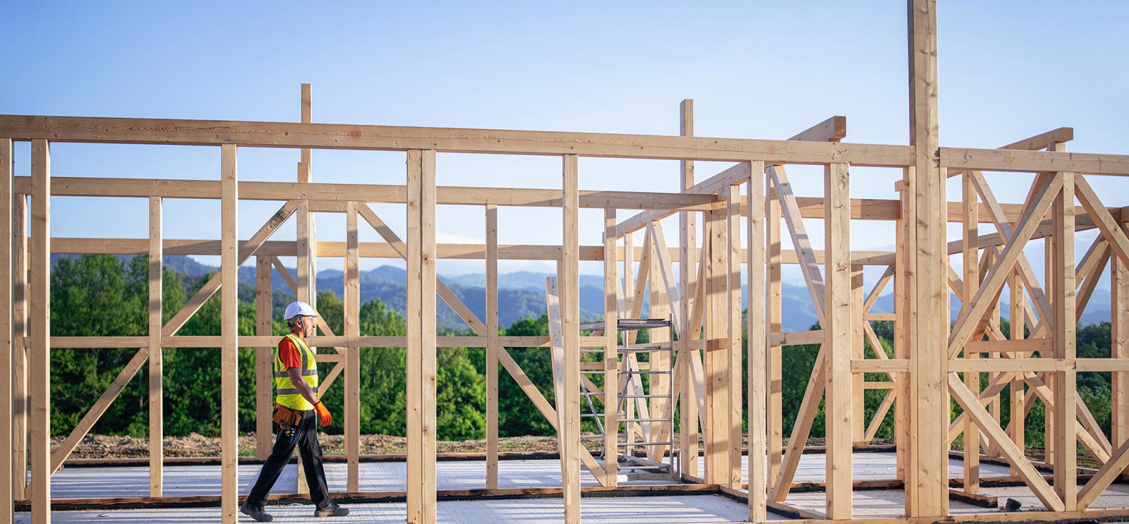 Construction worker walking on home project